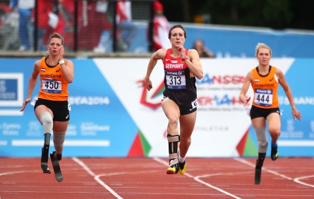 SWANSEA, WALES - AUGUST 21: Marlou van Rhijn of Holland (L) beats Germany's Irmgard Bensusan (R) to win the womens 200m T44 final during day three of the IPC Athletics European Championships at Swansea University Sports Village on August 21, 2014 in Swansea, Wales. (Photo by Charlie Crowhurst/Getty Images)